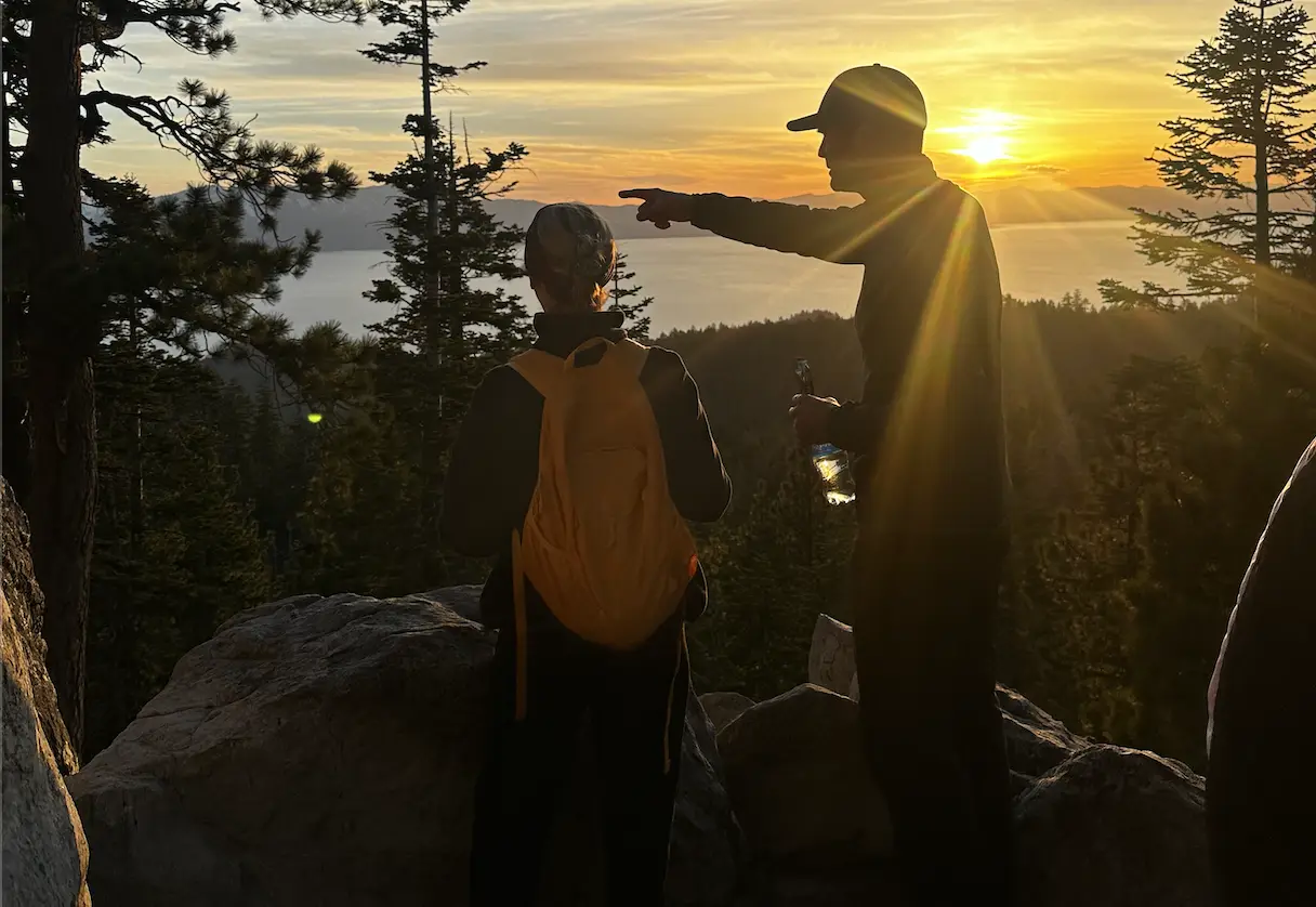Two guests watching the sunset over Lake Tahoe